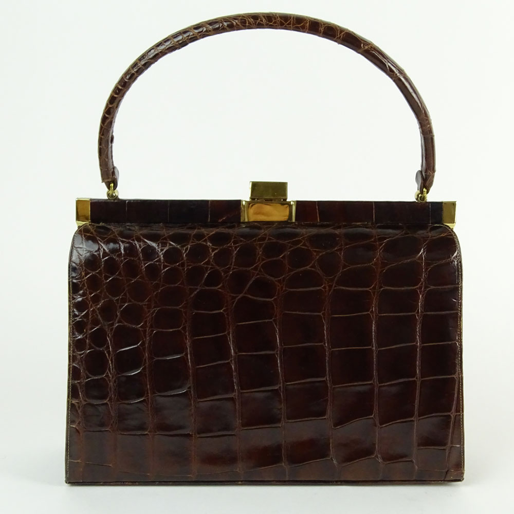 Vintage Alligator Handbag. Rich brown color with gold tone hardware.