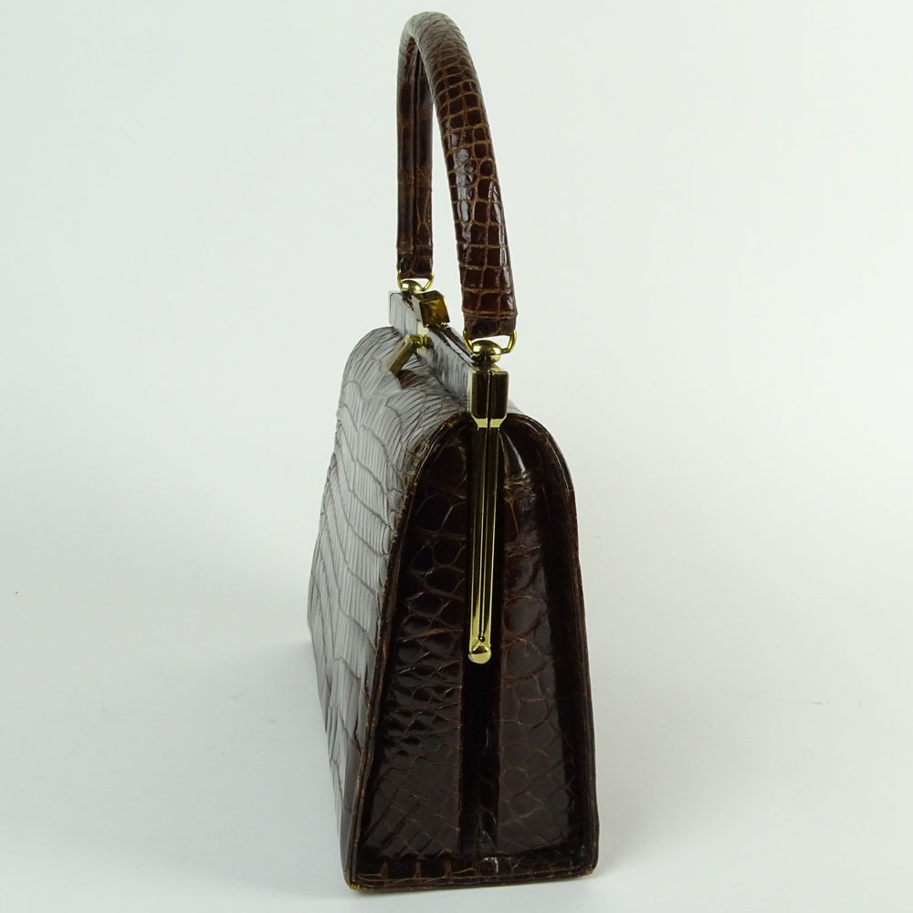 Vintage Alligator Handbag. Rich brown color with gold tone hardware.