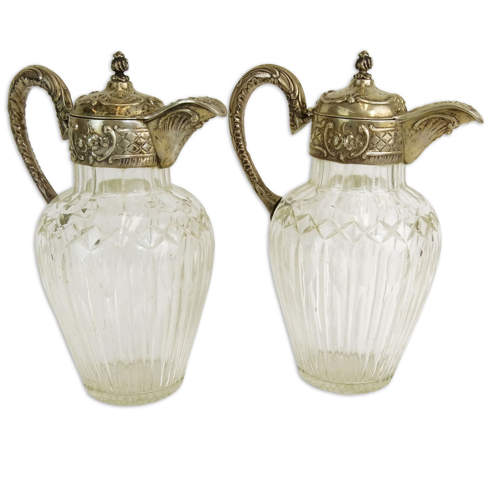 Pair of Victorian Silver Mounted Etched Crystal Ewers.