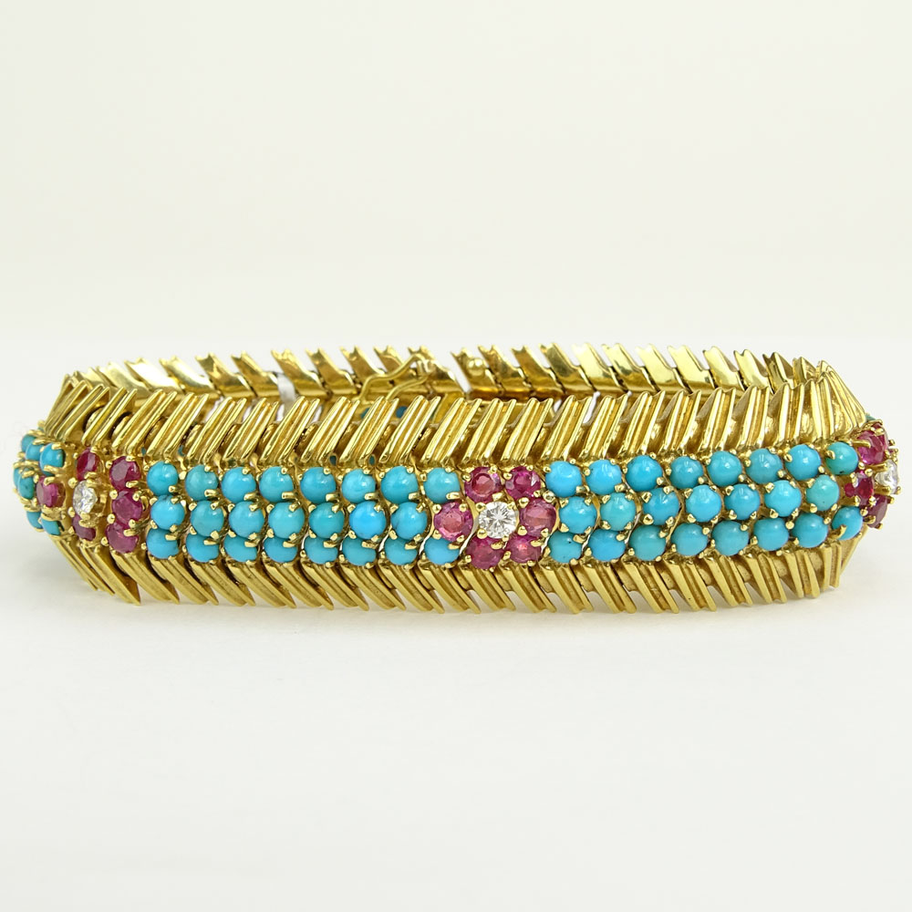 Circa 1950's 18 Karat Yellow Gold Bracelet Set with Round Cut Rubies, Diamonds and Persian Turquoise. 
