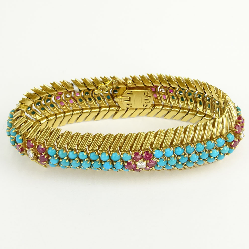 Circa 1950's 18 Karat Yellow Gold Bracelet Set with Round Cut Rubies, Diamonds and Persian Turquoise. 
