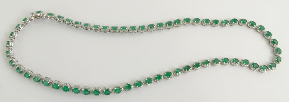 AIG Certified 20.63 Carat Oval Cut Emerald, 3.95 Carat Round Brilliant Cut Diamond and 14 Karat White Gold Necklace. 