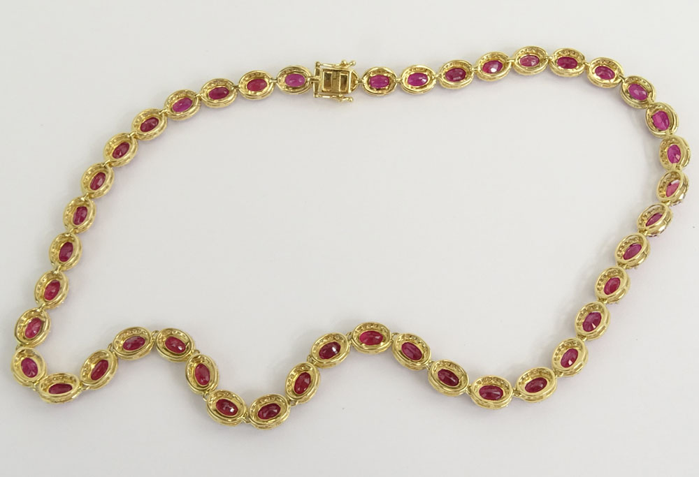 AIG Certified 48.49 Carat Oval Cut Ruby, 4.27 Carat Round Brilliant Cut Diamond and 14 Karat Yellow Gold Necklace. 