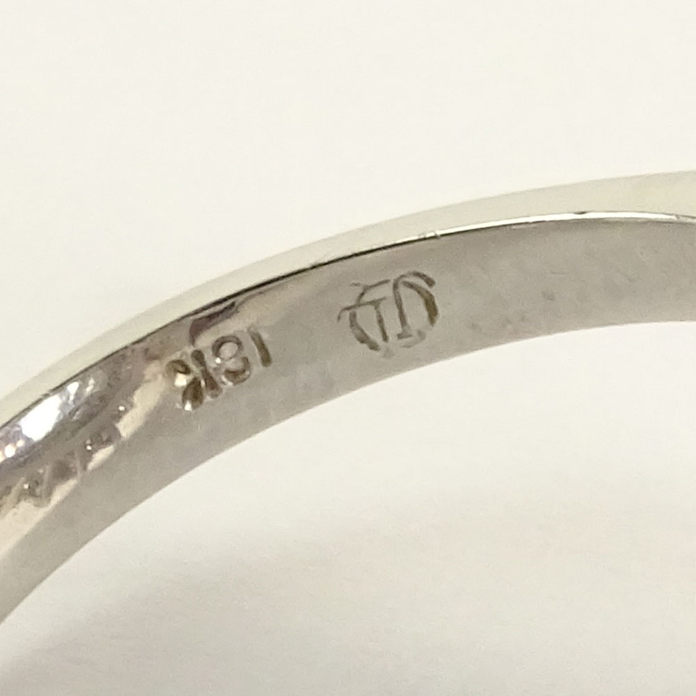 Lady's Oval Cut Tanzanite, Round Brilliant Cut Diamond and 18 Karat White Gold Ring.