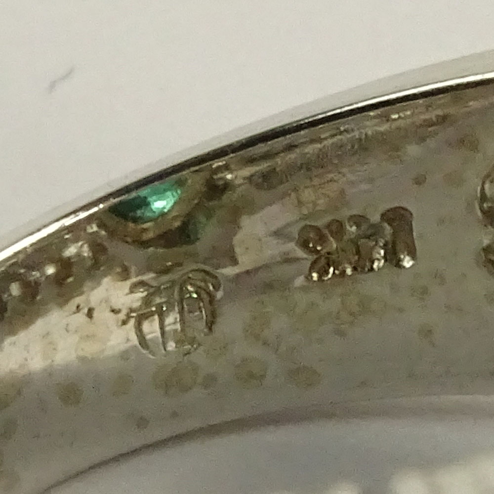Lady's Oval Cut Emerald,  Round Brilliant Cut Diamond and 14 Karat White Gold Ring. 