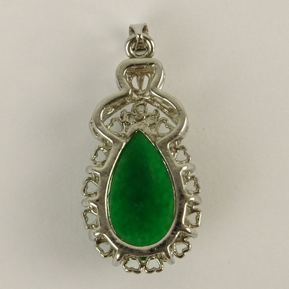 Vintage Green Jadeite Jade and 18 Karat White Gold Pendant accented with small round cut diamonds.