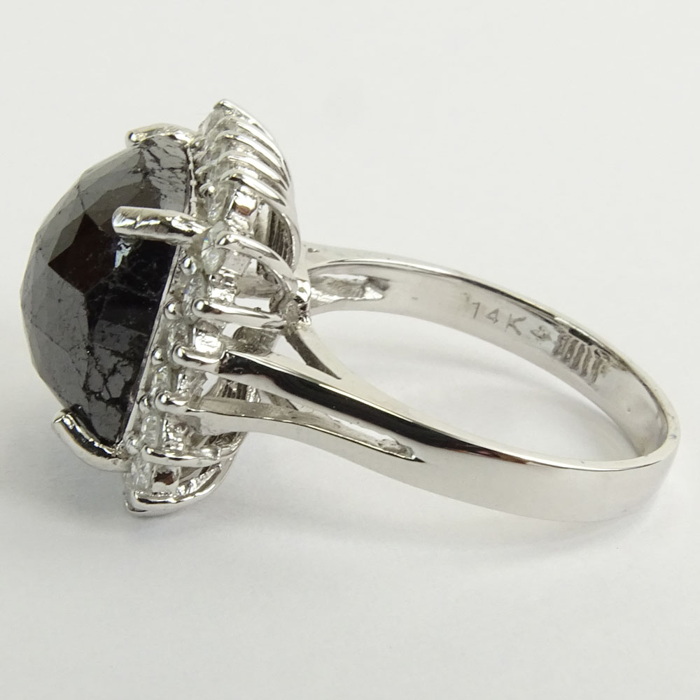 AIG Certified 7.22 Carat Cushion Cut Black Diamond and 14 Karat White Gold Ring accented with .69 Carat Round Brilliant Cut Diamonds.