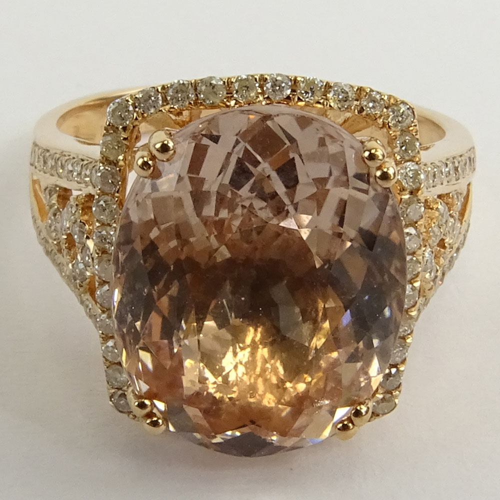 AIG Certified 7.60 Carat Oval Cut Morganite and 14 Karat Rose Gold Ring Accented with .42 Carat Round Brilliant Cut Diamonds.