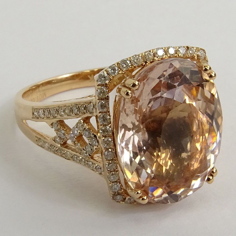 AIG Certified 7.60 Carat Oval Cut Morganite and 14 Karat Rose Gold Ring Accented with .42 Carat Round Brilliant Cut Diamonds.