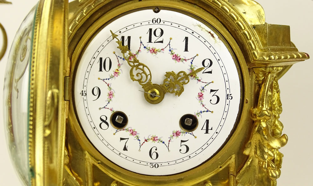Antique Three (3) piece French ormolu bronze clock garniture set. Figural motif, hand painted dial. 