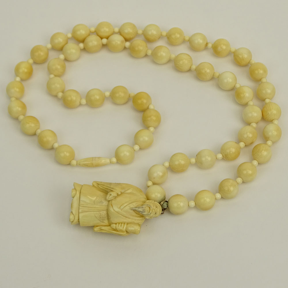 Japanese Ivory Bead Necklace with Carved Ivory Figural Pendant.