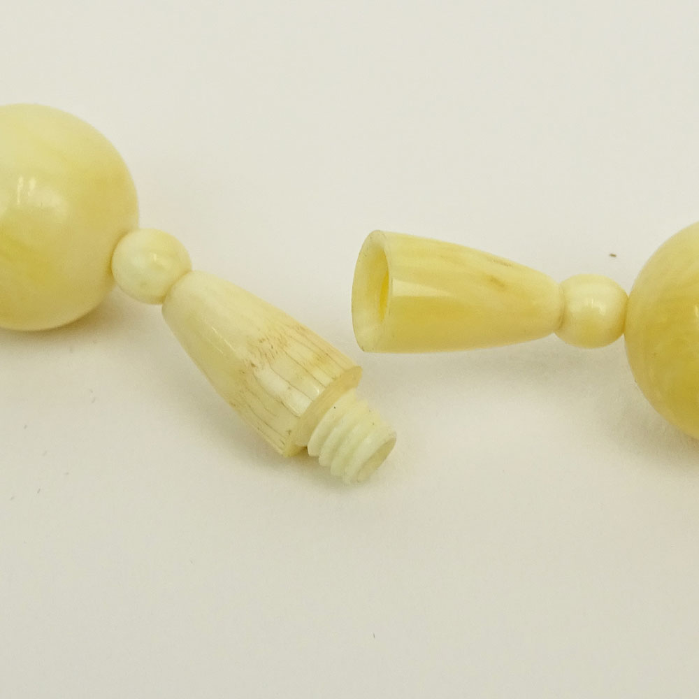 Japanese Ivory Bead Necklace with Carved Ivory Figural Pendant.