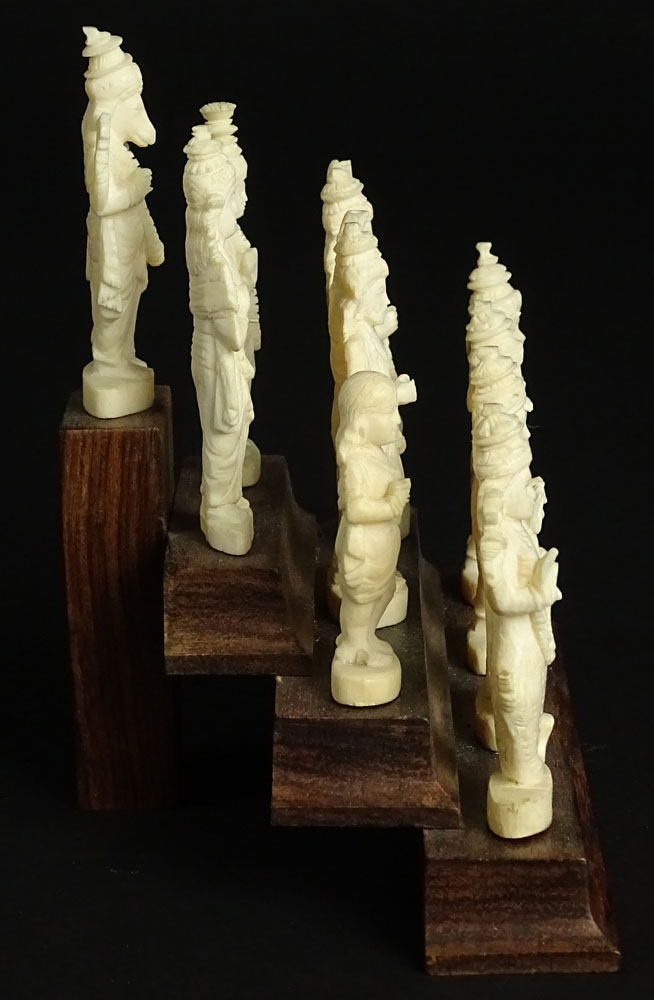 Ten (10) Indian Carved Ivory Deity Figures on Stepped Wood Base.