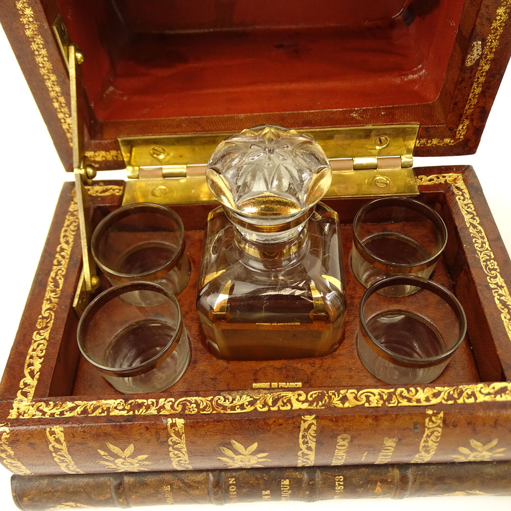 Vintage Tantalus Set in the form of a stack of books. Includes a small decanter and 4 glasses.