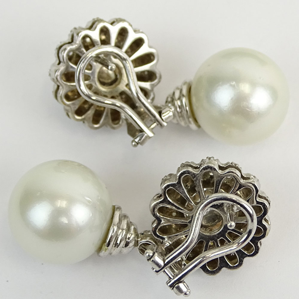 South Sea White Pearl, .90 Carat Round Cut Diamond and 18 Karat White Gold Pendant Earrings.