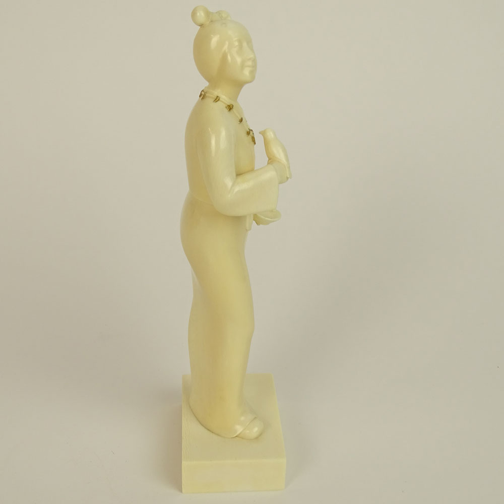 Japanese Finely Carved Ivory Figure of a Female Holding a Bird and Dish.
