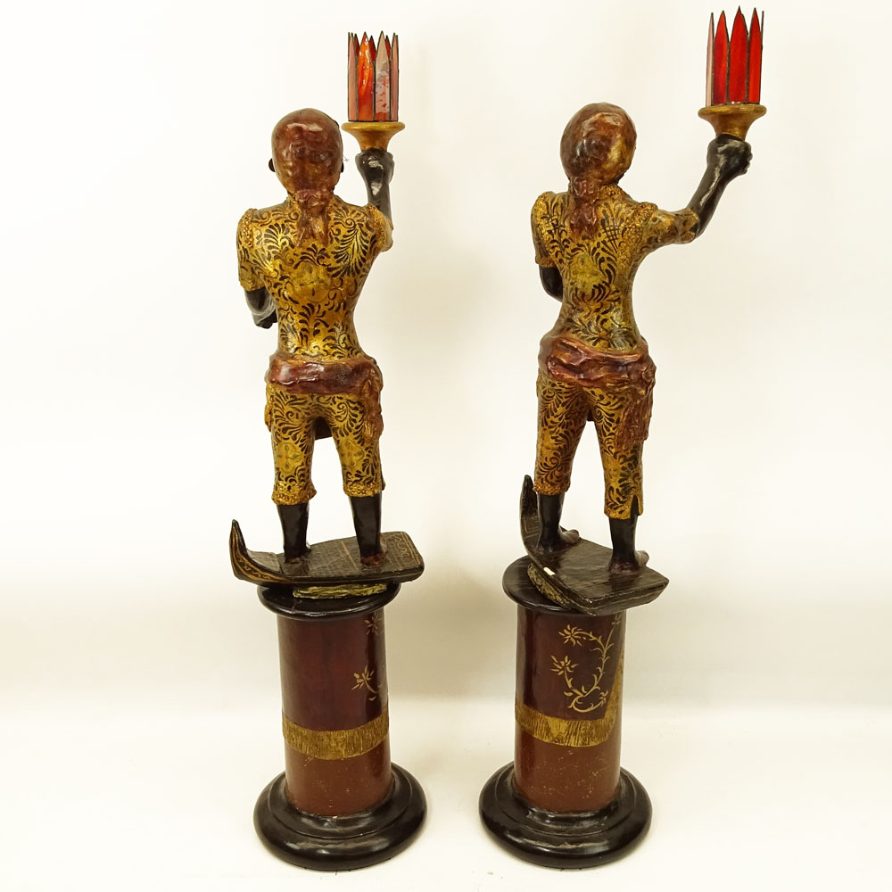 Pair of Early to Mid 20th Century Venetian style Carved Painted and Parcel Gilt Blackamoor Gondolier Figures on Bases.