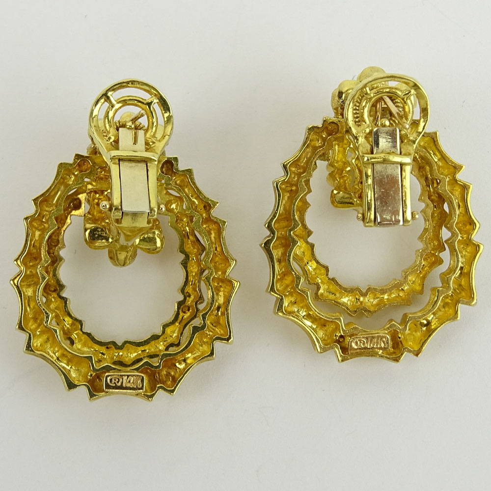 Pair of Vintage 14 Karat Yellow Gold Door Knocker style Earrings. Signed 14K.