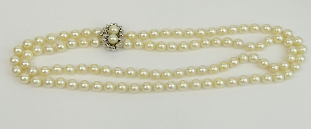 Vintage Double Strand White Pearl Necklace with 14 Karat White Gold and Diamond Clasp.