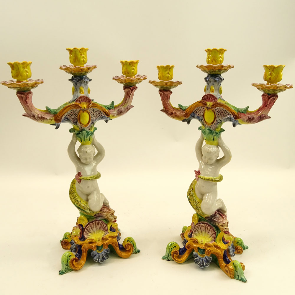 Pair of 20th Century Italian Majolica Figural Candlesticks. Each with 3 lights.