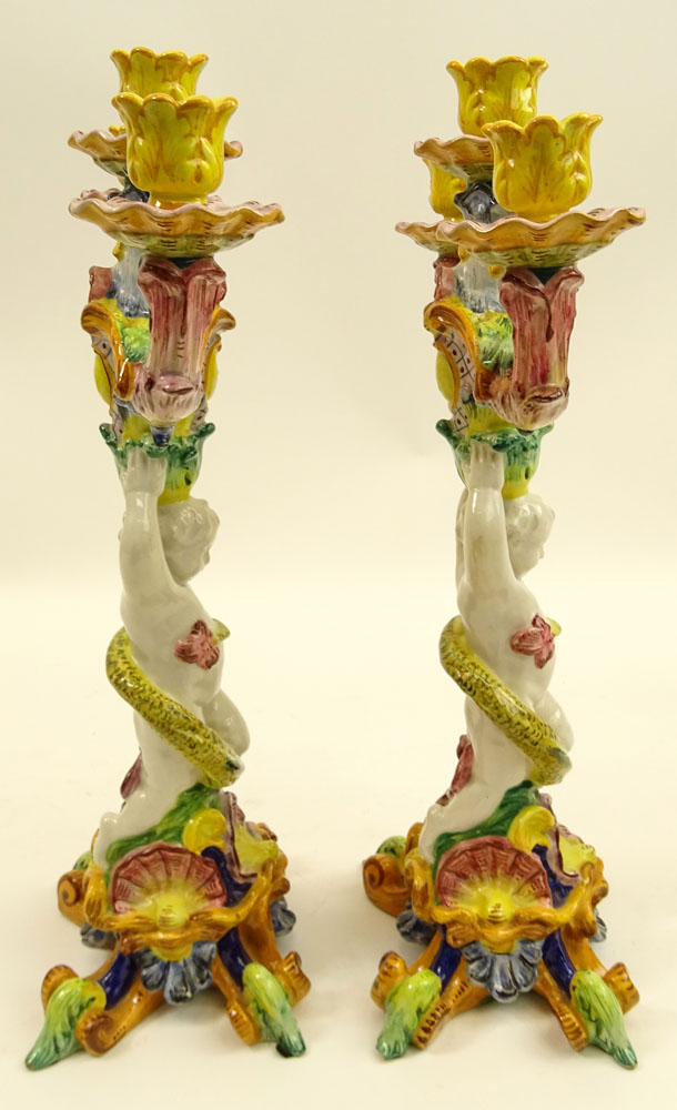 Pair of 20th Century Italian Majolica Figural Candlesticks. Each with 3 lights.