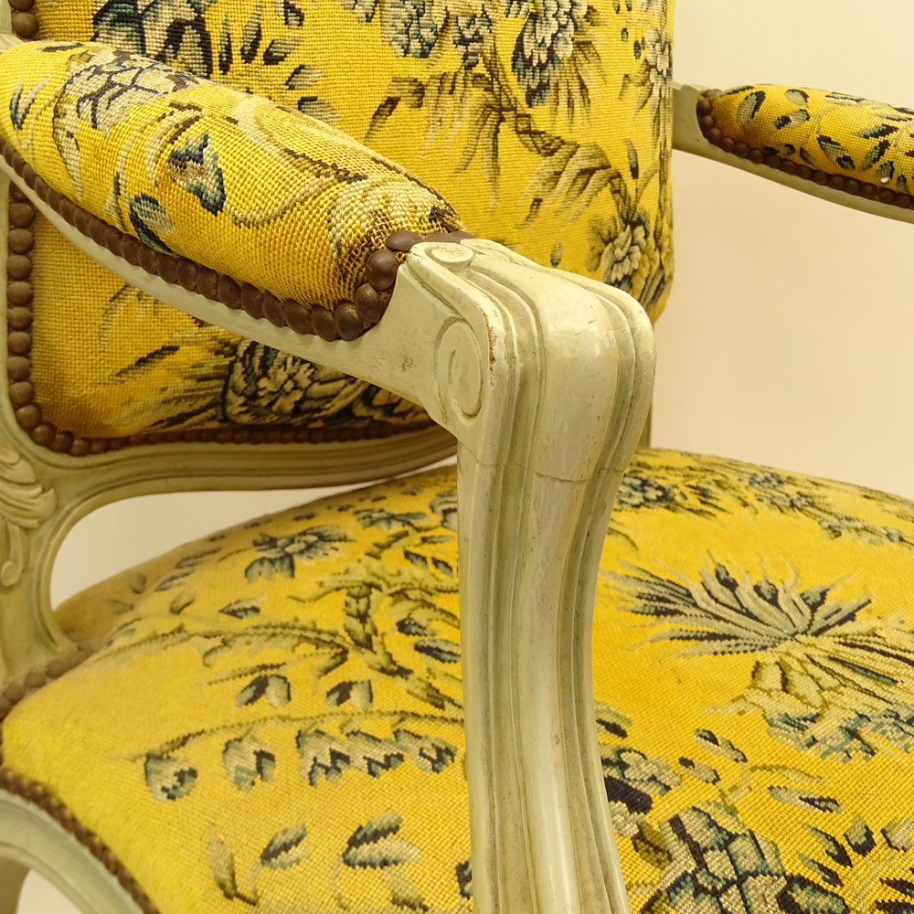 Set of Four (4) 19th Century French Louis XV style Carved and Painted Fauteuils with Petit Point Upholstery.