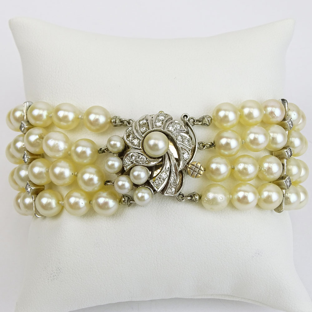 Vintage Four Strand Pearl, Diamond and 14 Karat White Gold Bracelet. 