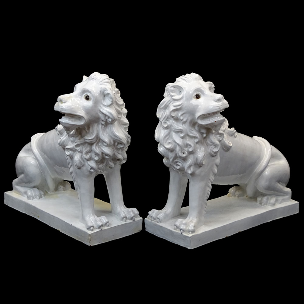 Pair of Large Vintage French White Glazed Faience Lions With Glass Eyes.