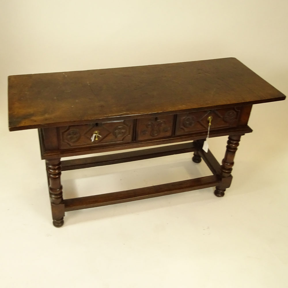 19th Century Continental Carved Oak Trestle Table With Three Drawers.