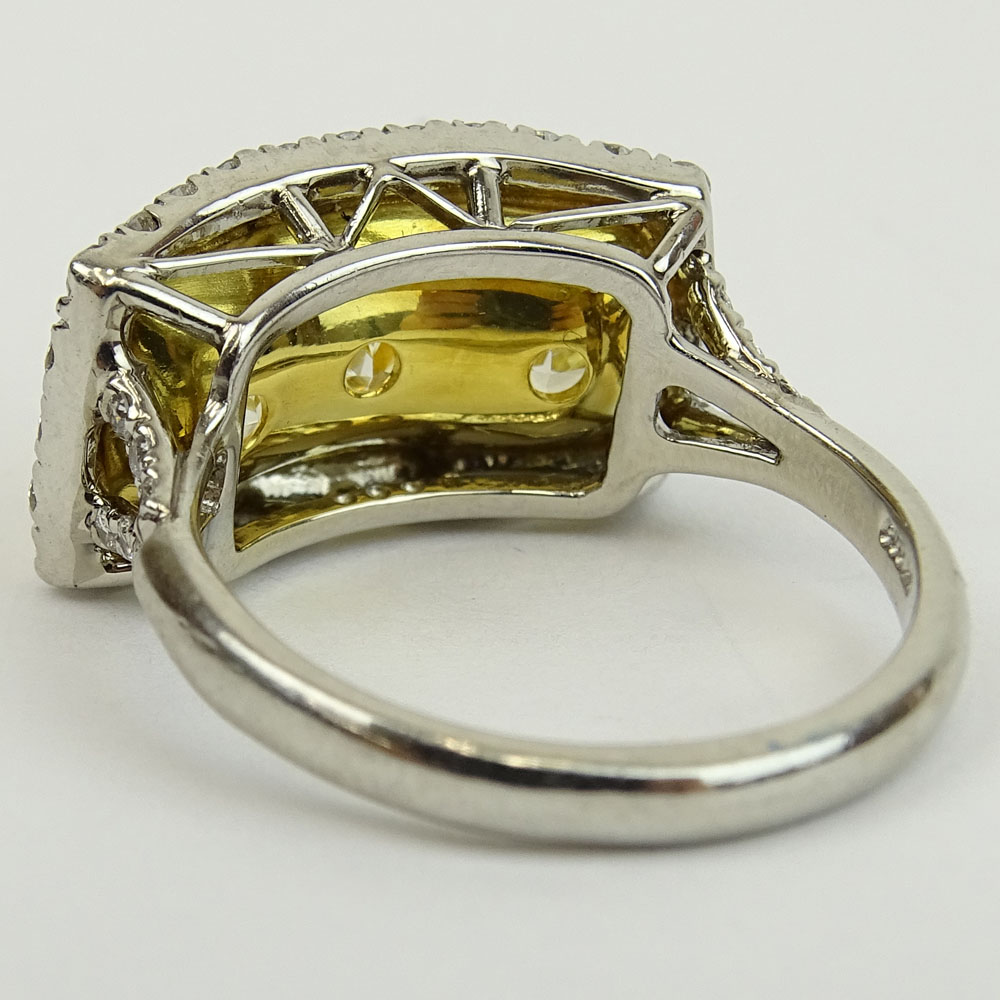 Fancy Yellow Diamond and Platinum Three Stone Ring Set with Three (3) Cushion Cut Diamonds