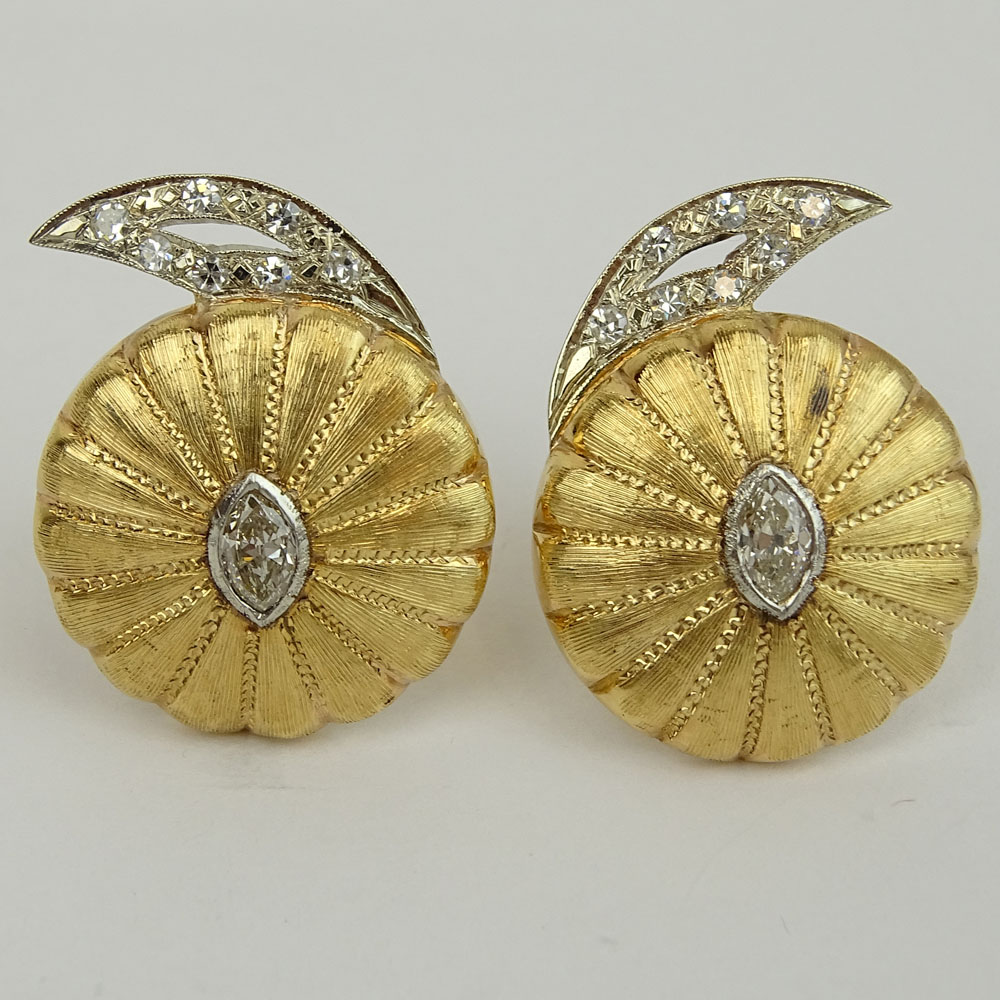 Pair of Vintage 14 Karat Yellow Gold Button style Earrings Set with Approx. 1.20 Carat Marquise Cut Diamonds and further accented with Round Brilliant Cut Diamonds.