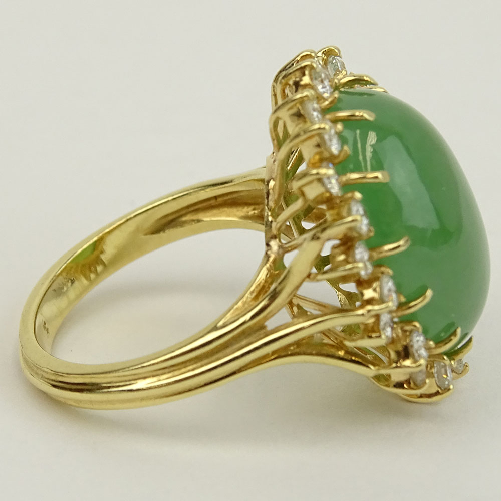 Vintage 14 Karat Yellow Gold Ring Set with Green Jade and Accented with Approx. 1.50 Carat Round Brilliant Cut Diamonds.