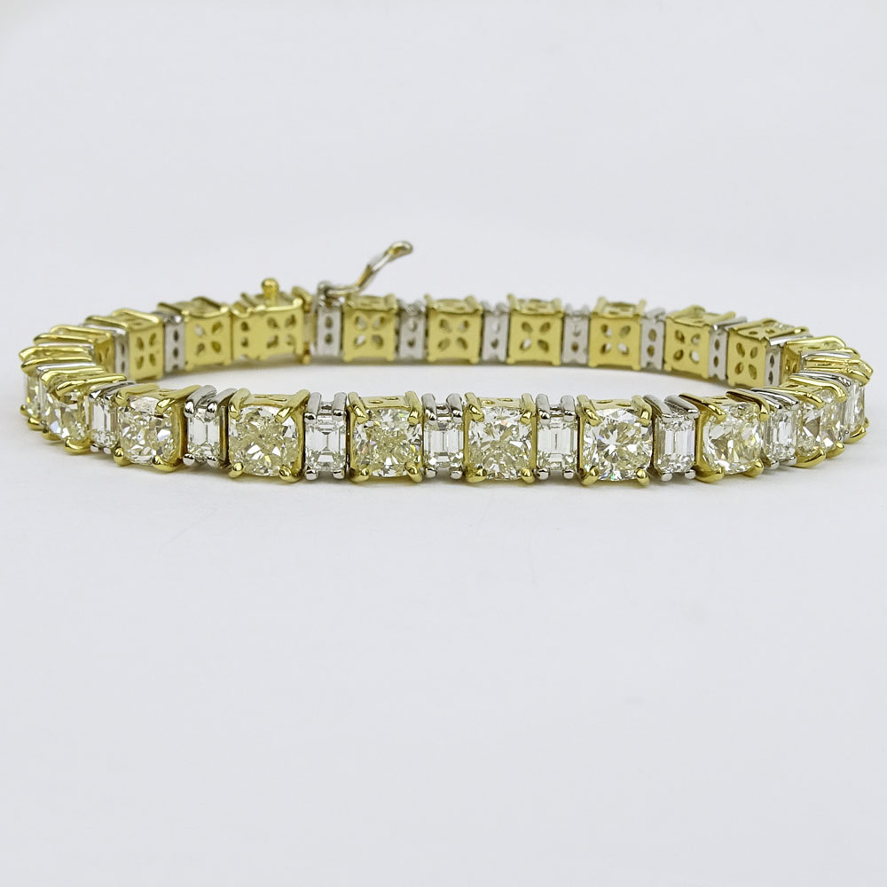 Stunning Diamond, Platinum and 18 Karat Yellow Gold Bracelet Set with Twenty-One (21) Cushion Cut Diamonds Approx. 21.25 Carats TW and Twenty-One (21) Emerald Cut Diamonds Approx. 6.0 Carats. 