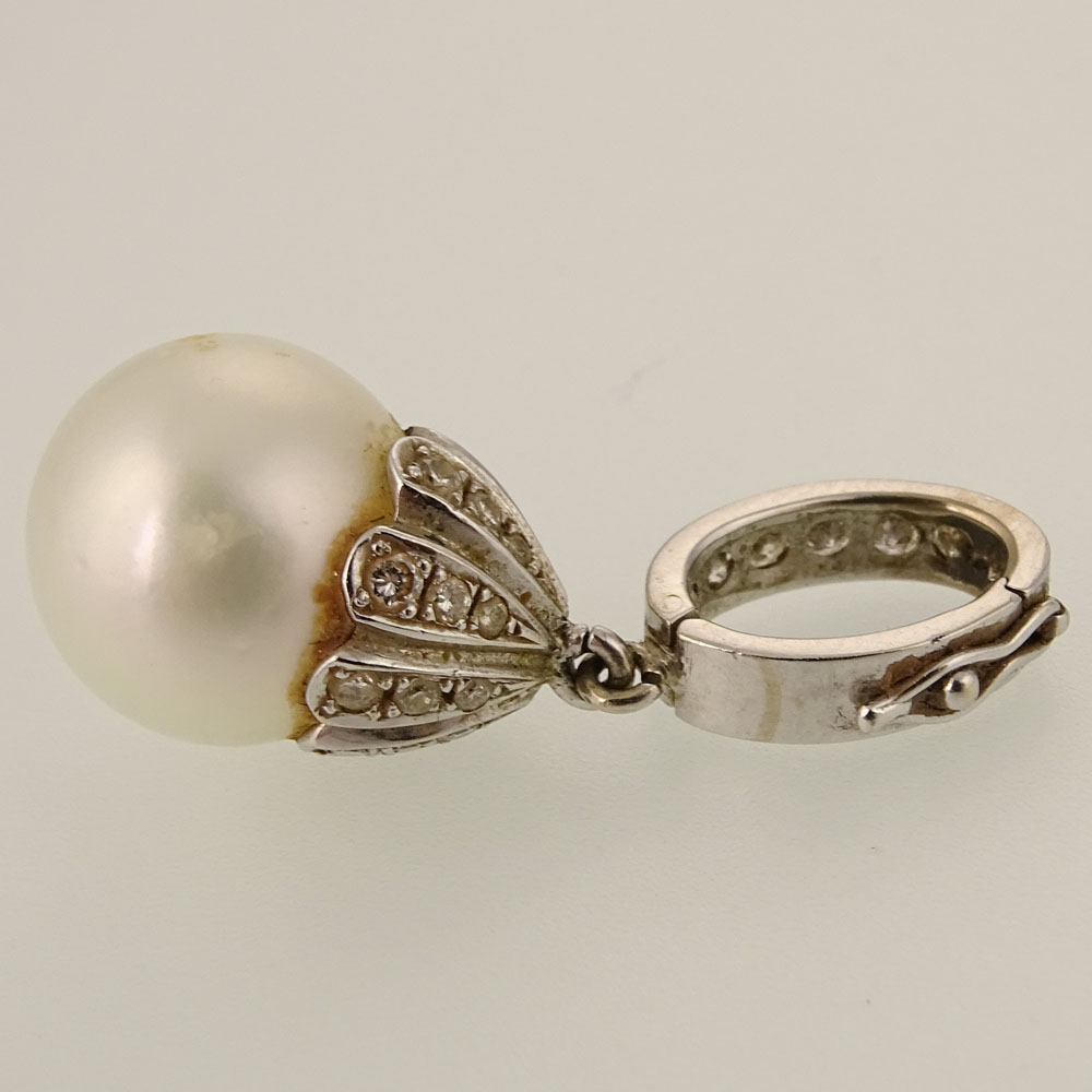 Assembled Four (4) Piece Pearl, Diamond and White Gold Suite Including Ring, Pair of Earrings and Pendant. 
