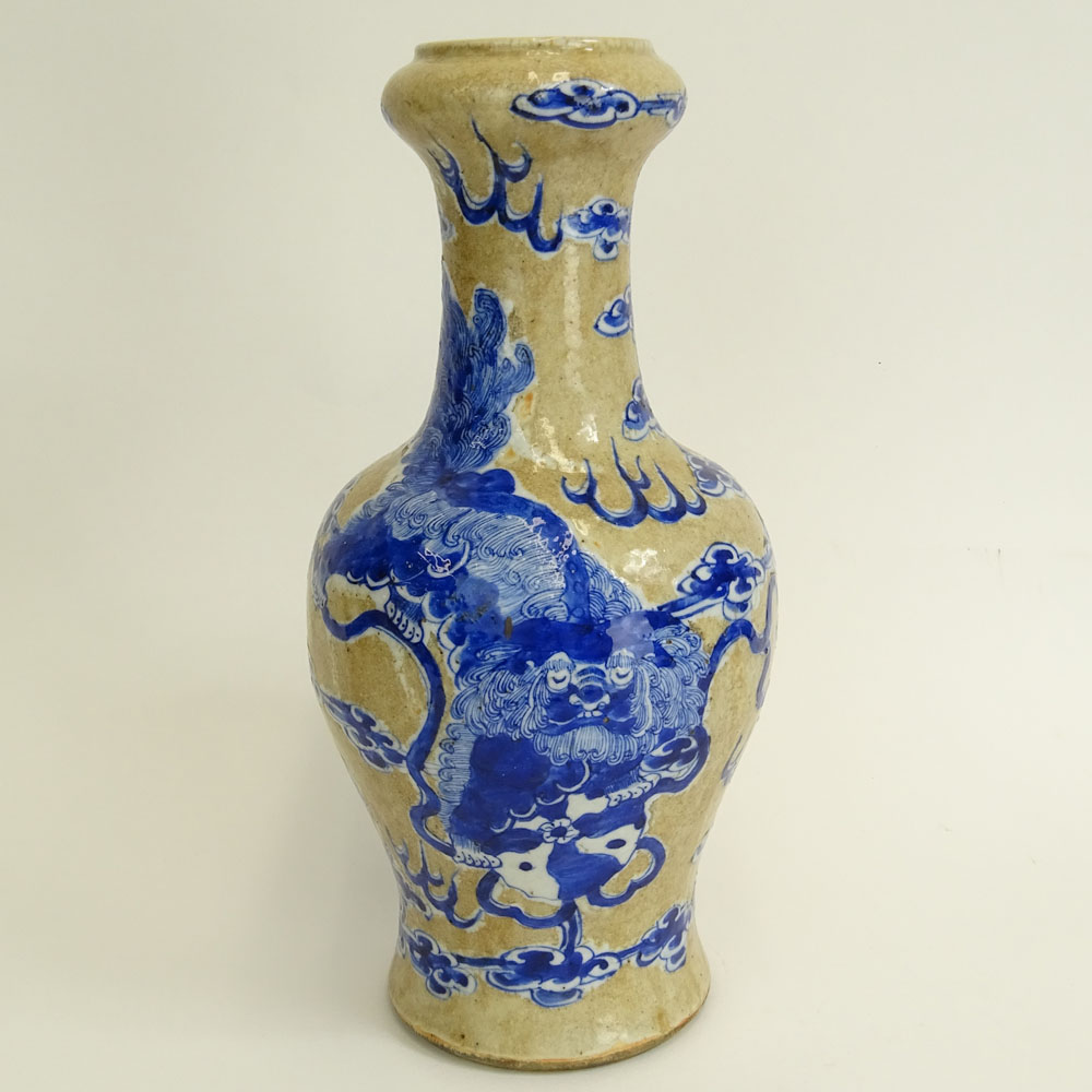 Antique Chinese Porcelain Baluster Vase with Blue and White Dragon and Clouds Motif.