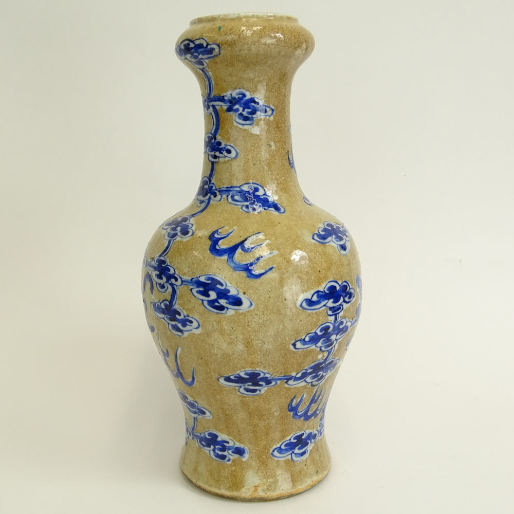 Antique Chinese Porcelain Baluster Vase with Blue and White Dragon and Clouds Motif.