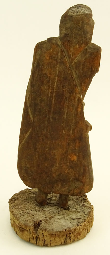 Early Continental Wood Carving of a Man on Cork Base.