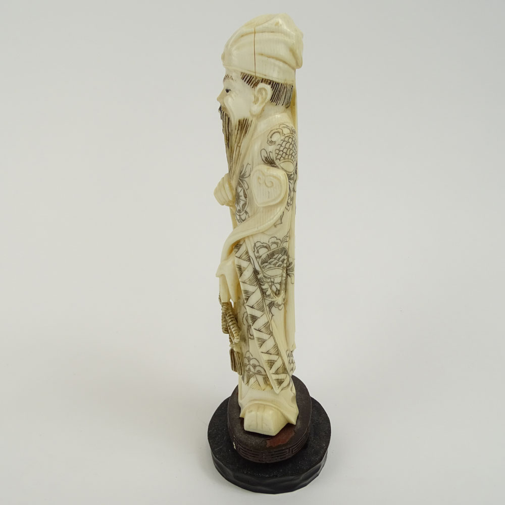 Vintage Carved Chinese Ivory Figure  on hardwood stand of a Man Holding a Ruyi.