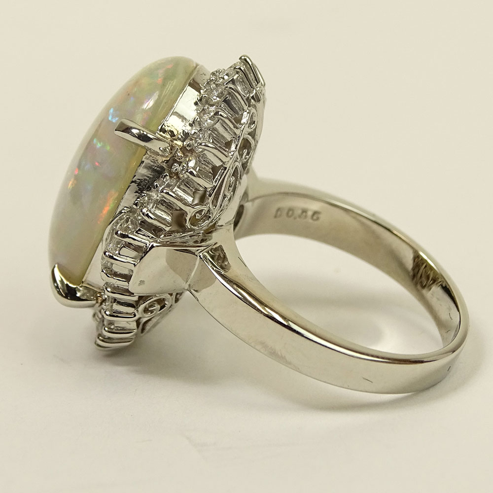 Lady's Approx. 8.31 Carat Oval Cut White Opal, .86 Carat Diamond and Platinum Ring. 