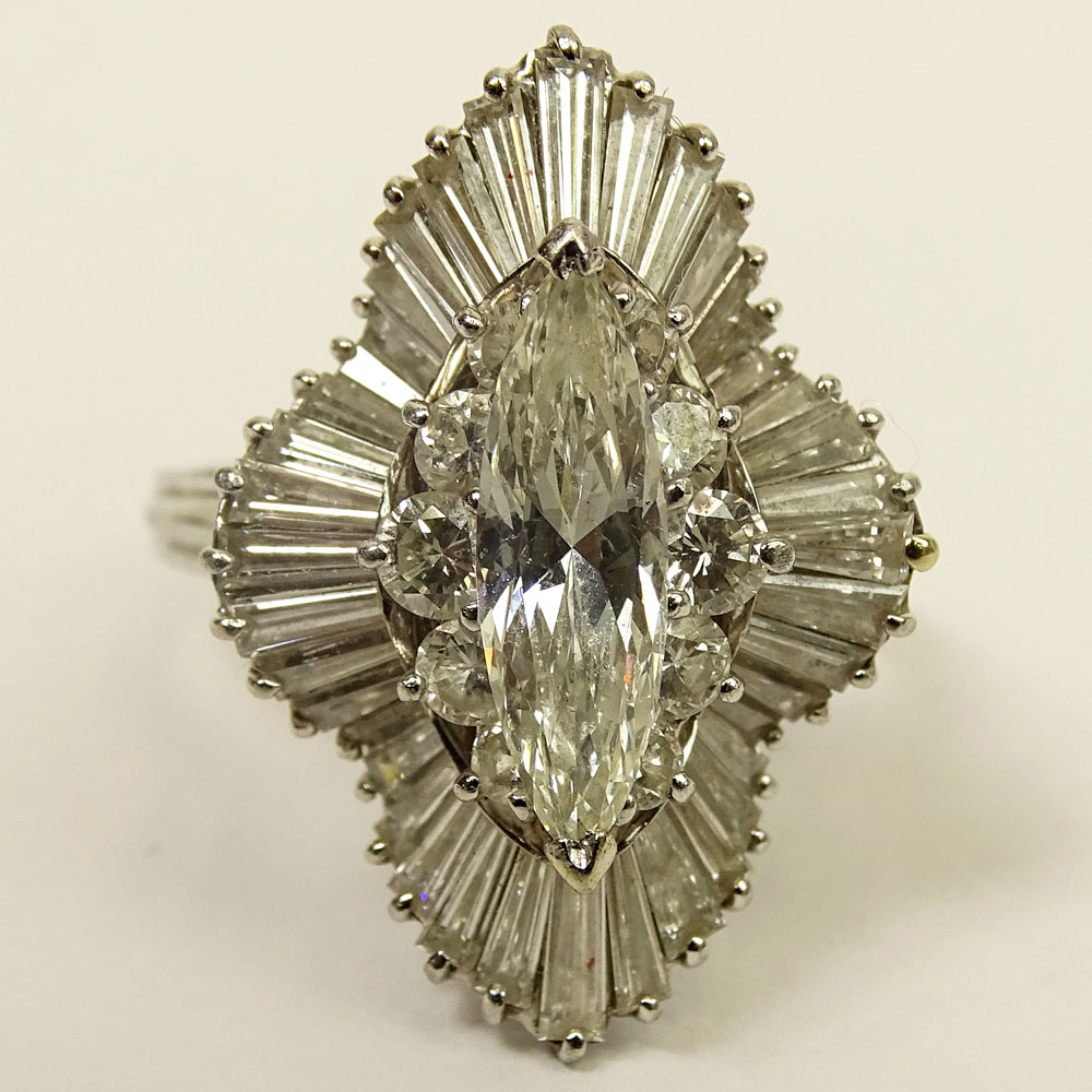 Vintage Approx. 6.0 Carat Total Weight Diamond and Platinum Ballerina Ring Set in the Center with a Marquise Diamond
