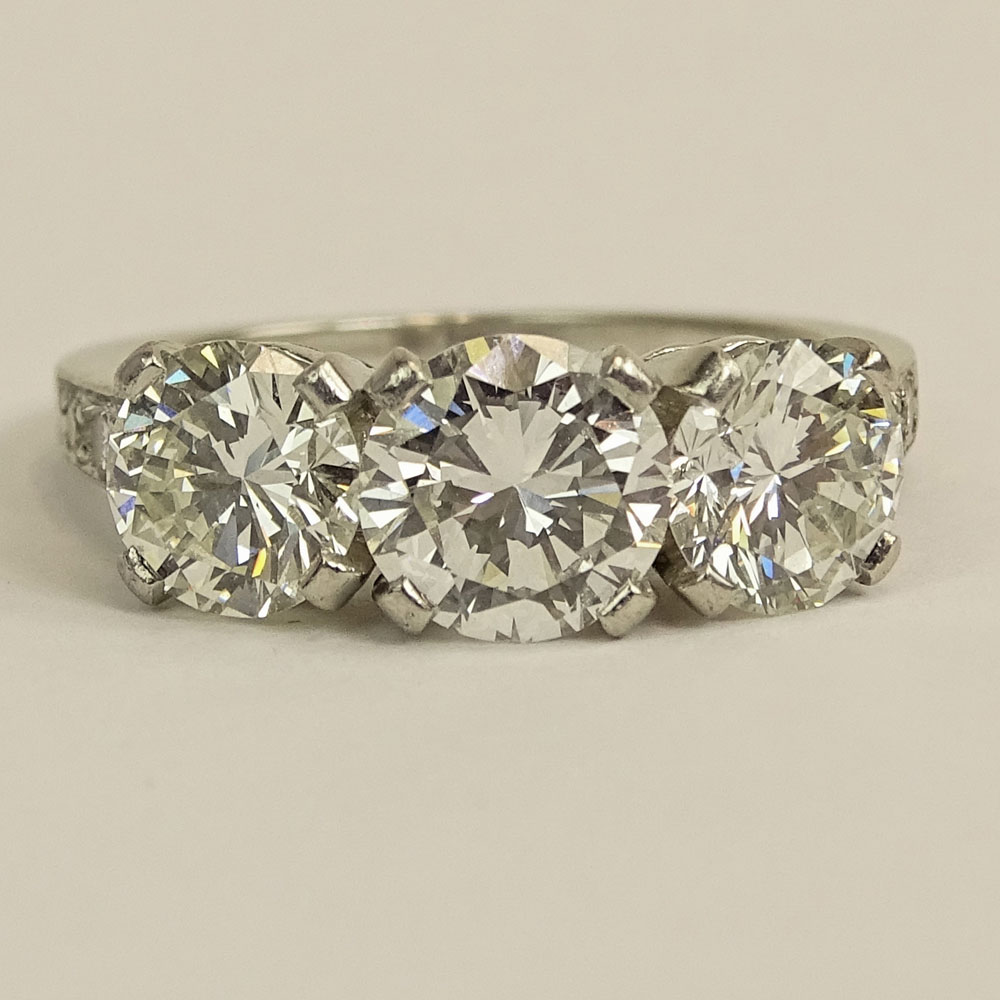 Tiffany & Co Three (3) Stone Diamond and Platinum Ring.