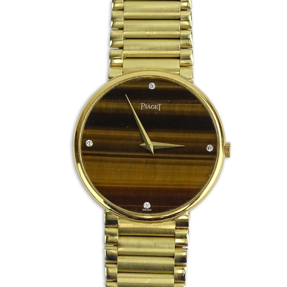 Men's Vintage 14 Karat Yellow Gold Bracelet Watch with Tiger Eye Dial and Diamond Hour Markers.