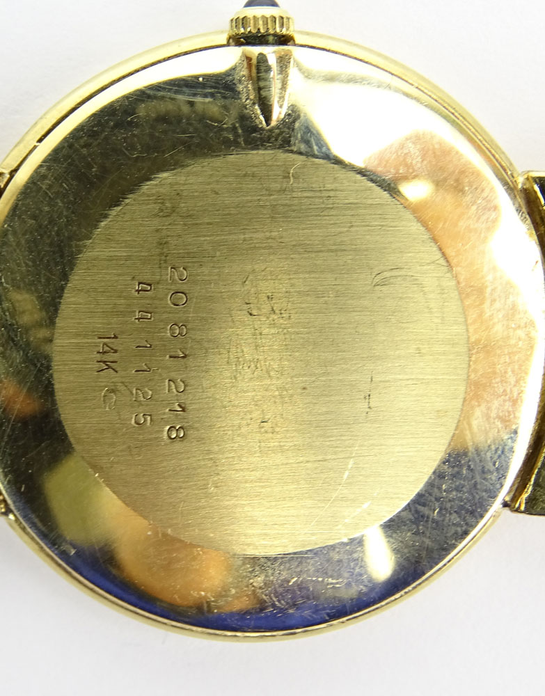 Men's Vintage Concord 14 Karat Yellow Gold Bracelet Watch with Quartz Movement.