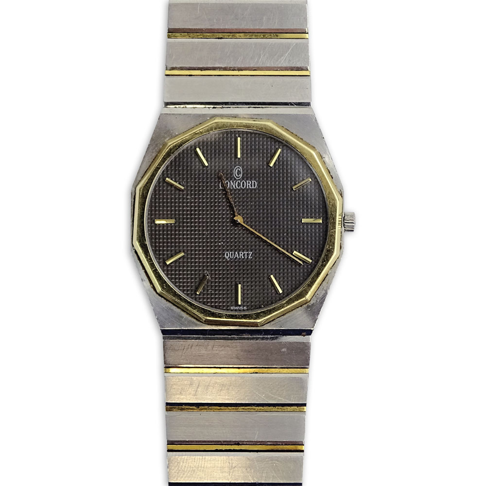 Men's Vintage Concord Stainless Steel and Gold Plate Bracelet Watch with Quartz Movement.
