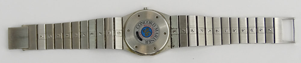 Men's Vintage Concord Stainless Steel and Gold Plate Bracelet Watch with Quartz Movement.