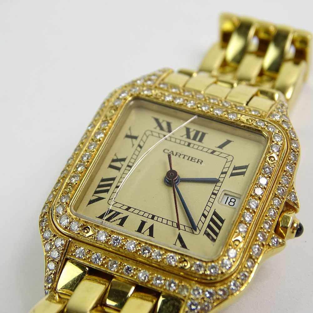 Lady's Cartier 18 Karat Yellow Gold Panther Watch with Diamond Bezel and Quartz Movement.