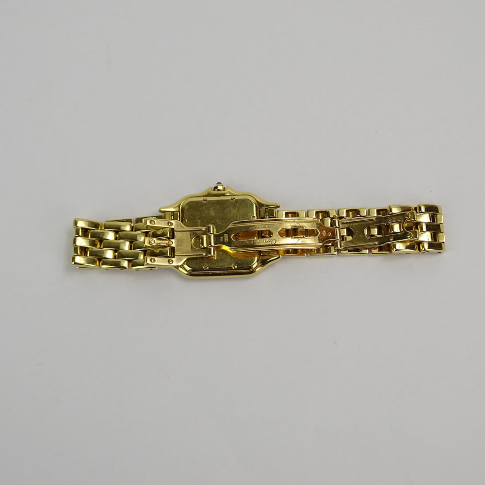 Lady's Cartier 18 Karat Yellow Gold Panther Watch with Diamond Bezel and Quartz Movement.