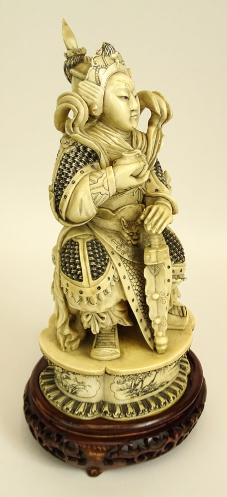 Heavy Chinese Carved Ivory Seated Warrior Figure on Carved Wood Base.