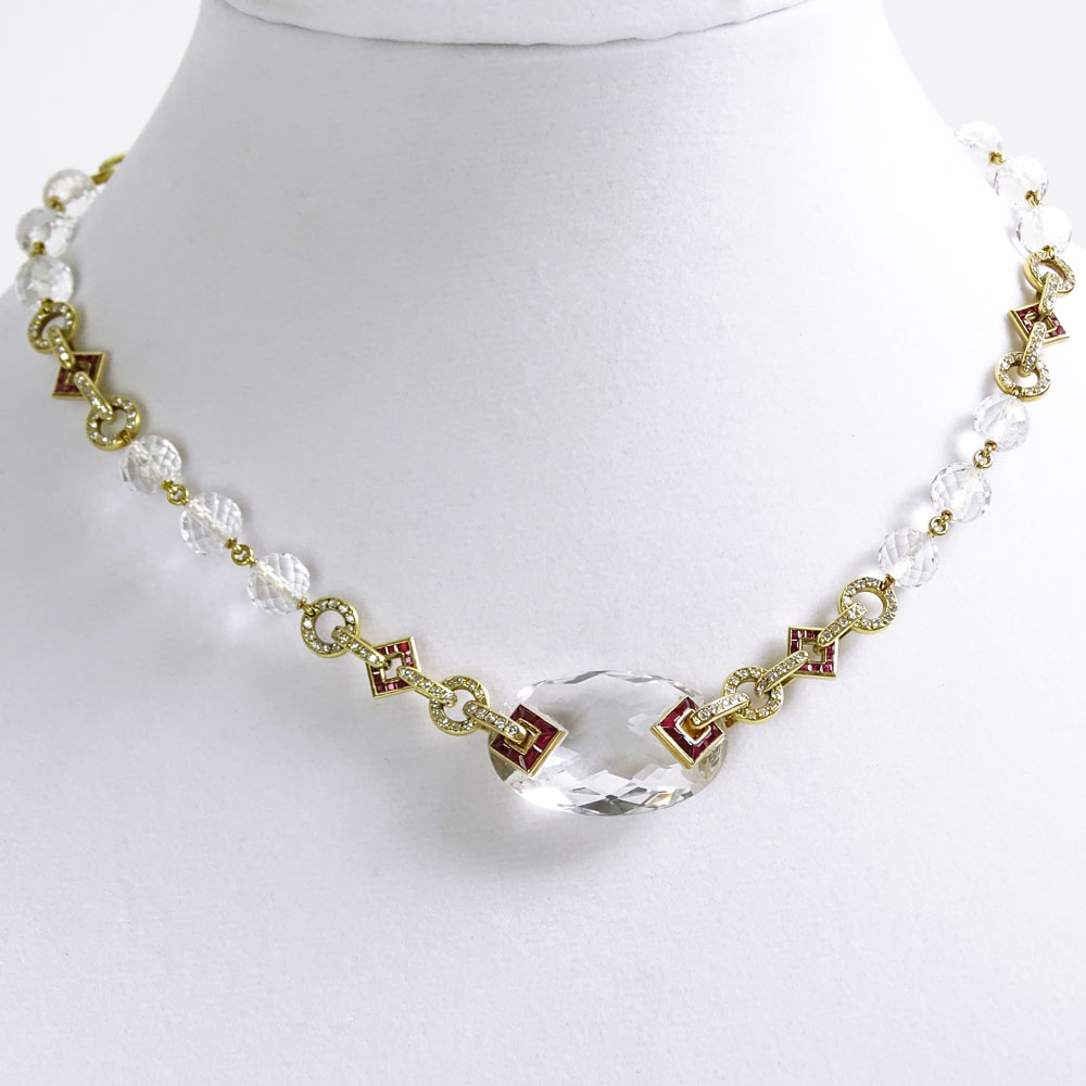 Art Deco Design 18 Karat Yellow Gold Necklace with Carved Rock Crystal Beads Accented throughout with 2.50 Carat Invisible Set Rubies and 4.0 Carat Round Cut Diamonds.