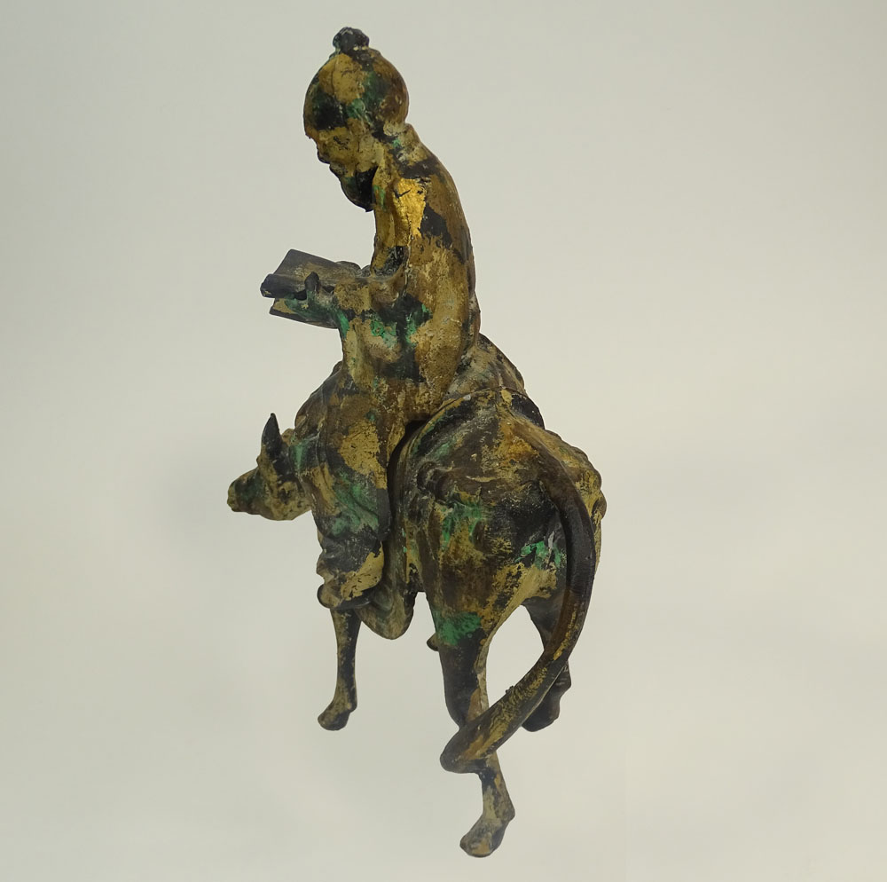 A Chinese Iron Sculpture Depicting a Scholar on a Donkey and a Miniature Ming Tree.